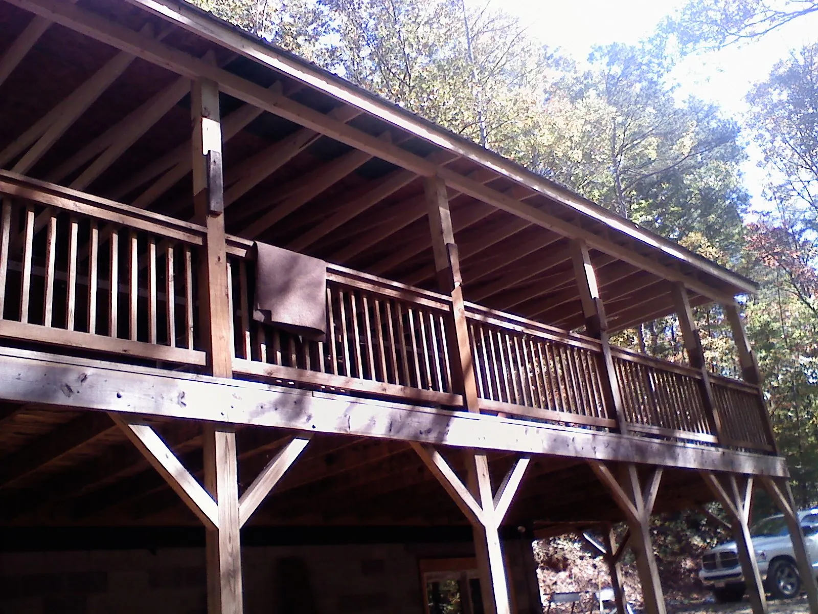 Timber framing under a new elevated porch and deck — Roof Leak Repair in Rhodesdale by Roofing Brothers
